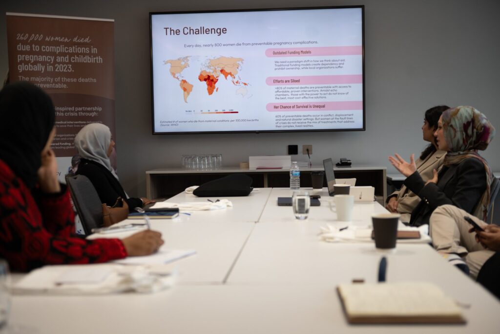 Isra Chaker in a meeting via Isra Chaker